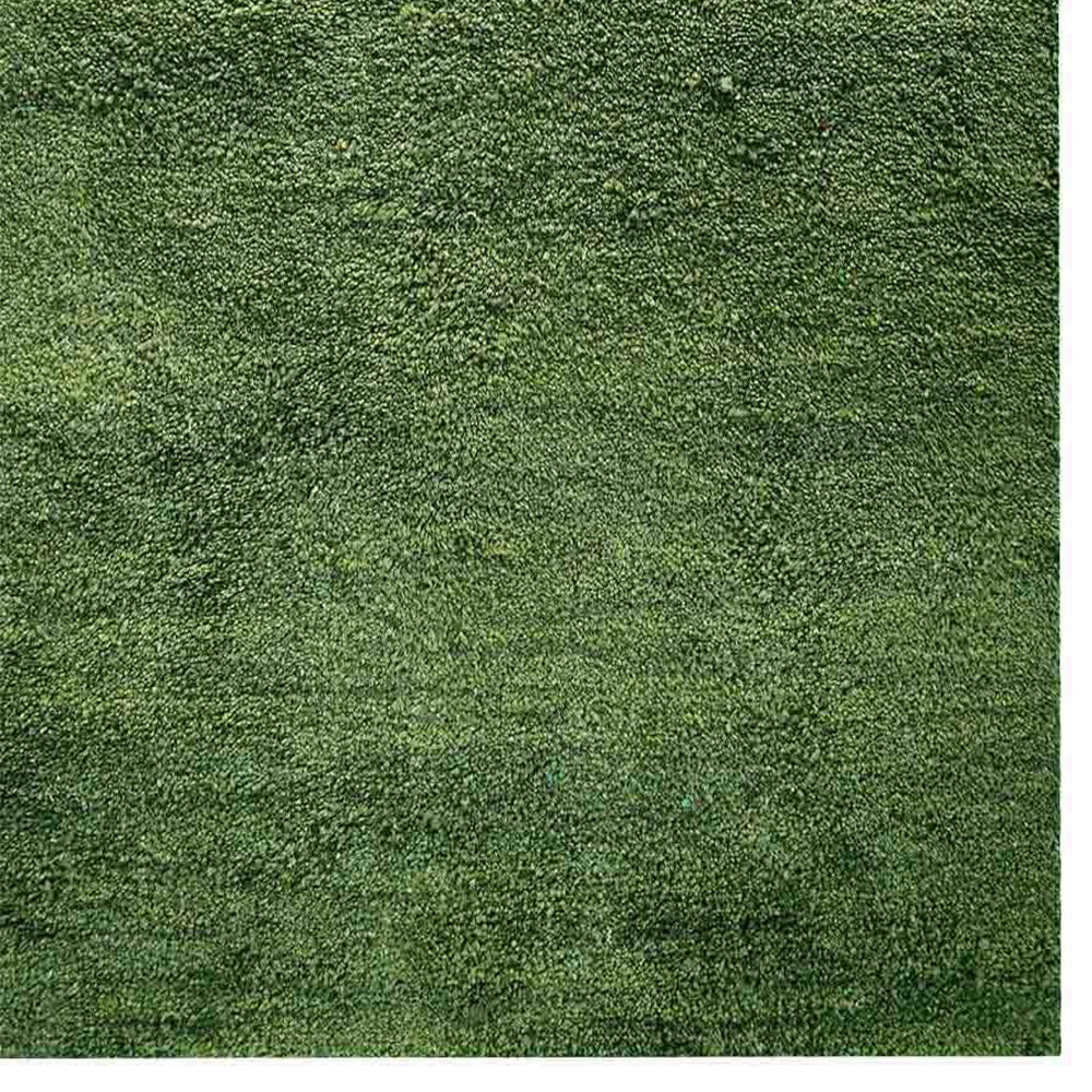 hand-knotted-loom-silk-area-rug-solid-light-green-closeup 1