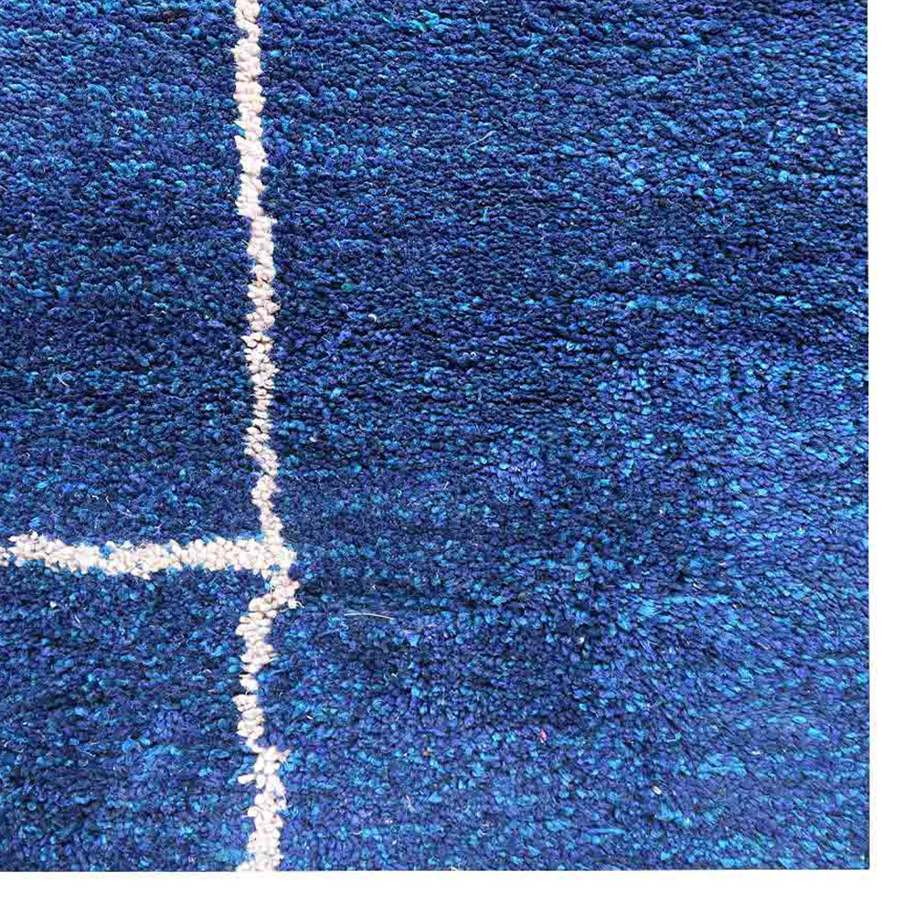 hand-knotted-loom-silk-area-rug-geometric-dark-blue-beige-closeup 1