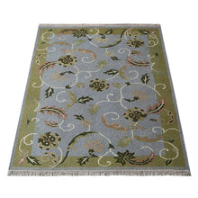 hand-knotted-sumak-wool-floral-area-rug-side-1