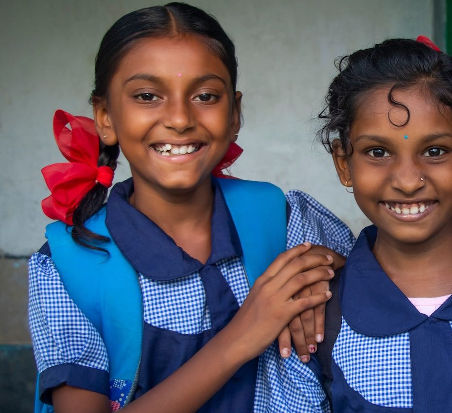 Weavers' children in school uniforms